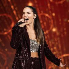 Lea Sirk, slovenska pevka, magistrica flavte, avtorica glasbe, performerka in glasbena mentorica.